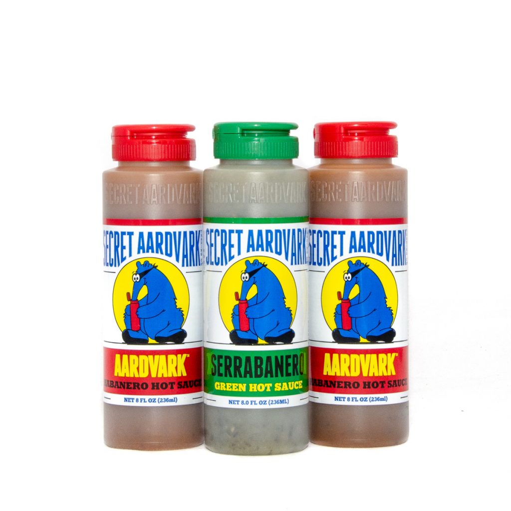 bottles of aardvark sauce and serrabanero
