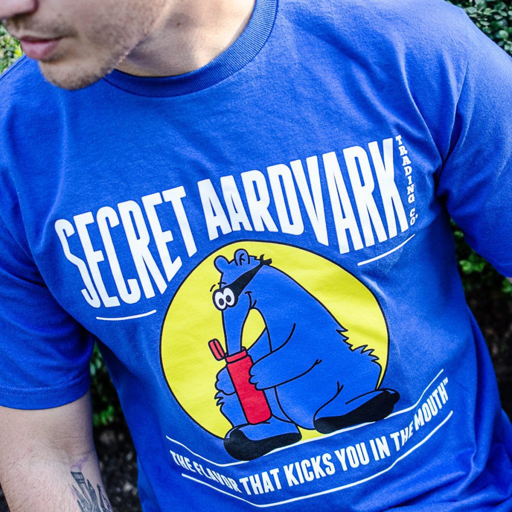 Person wearing a blue secret aardvark t-shirt