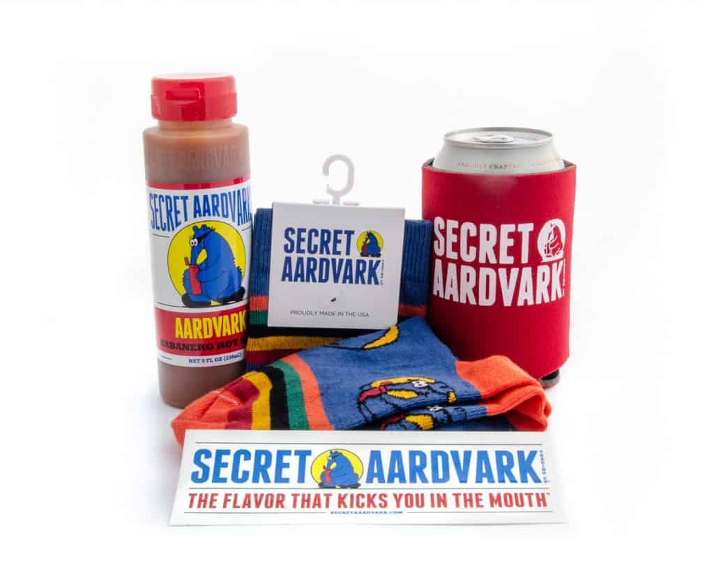 secret aardvark sauce, koozie, socks, and sticker
