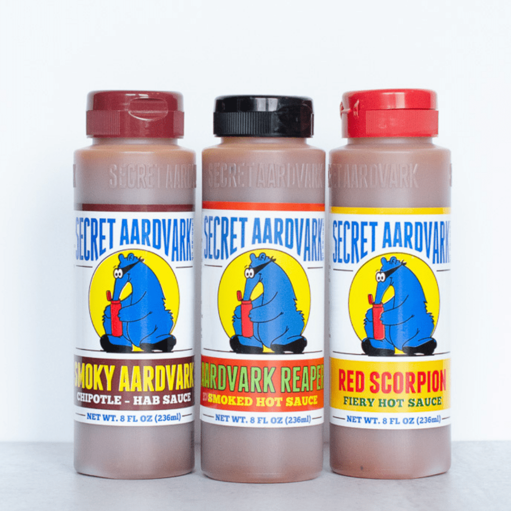3 bottles of hot sauce. Smoky Aardvark, Aardvark Smoked Reaper, Red Scorpion Fiery Hot Sauce.