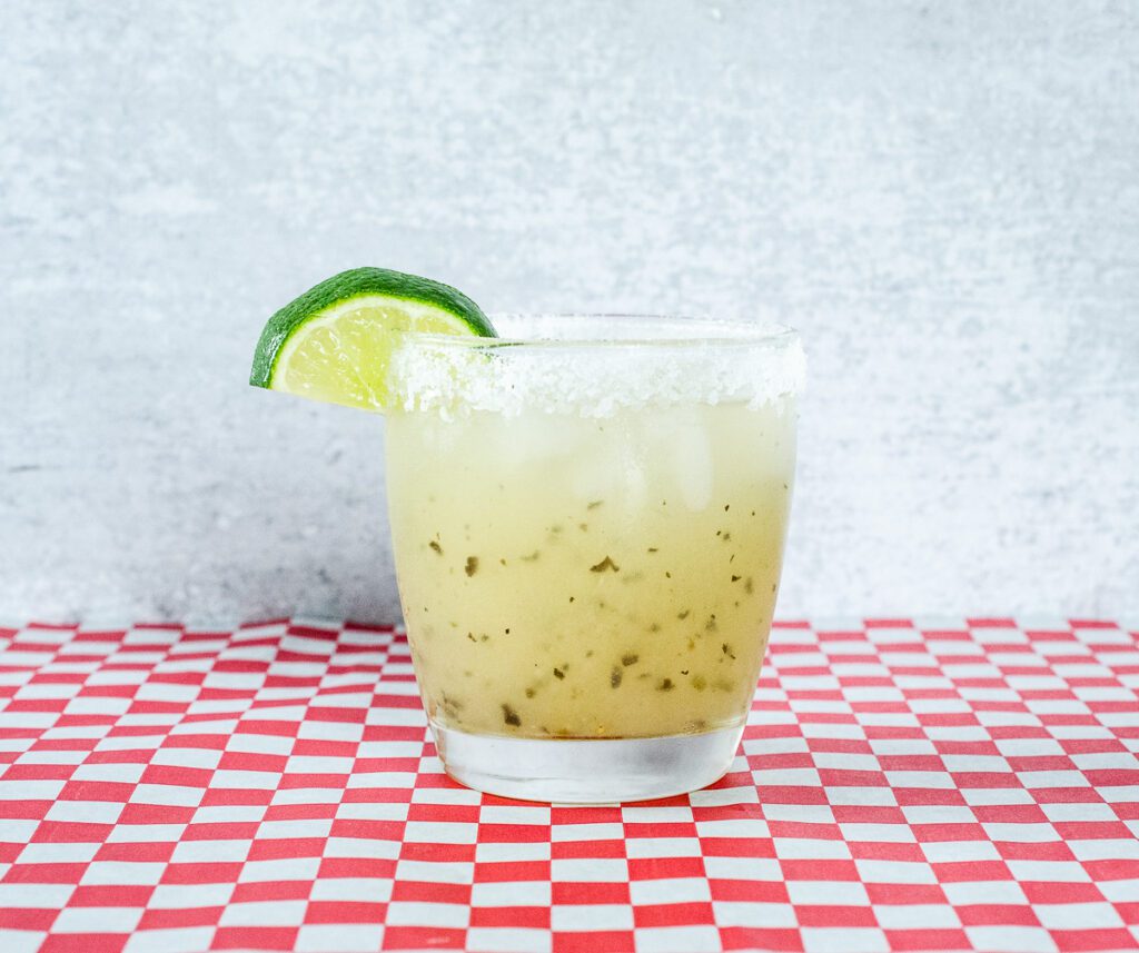 Aardvark Serrano Margarita in a glass w/ lime wedge