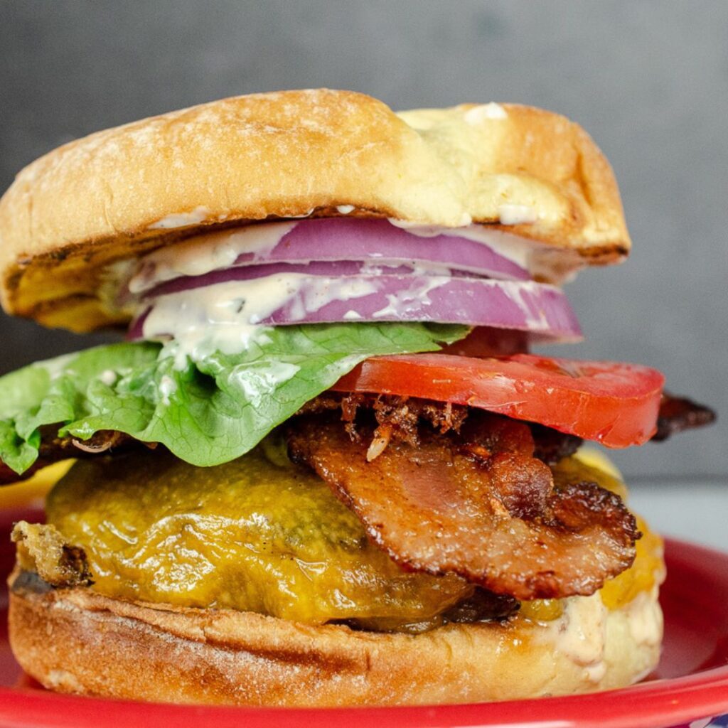 Tasty burger with bacon