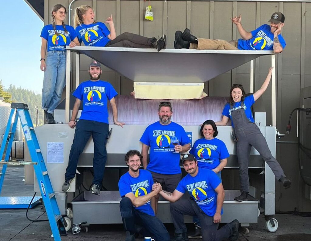 The team at Bergstrom Wines (all eight of them) show off their Secret Aardvark T-shirts while working at the Bergstrom Winery. Gotta say we love their style.
