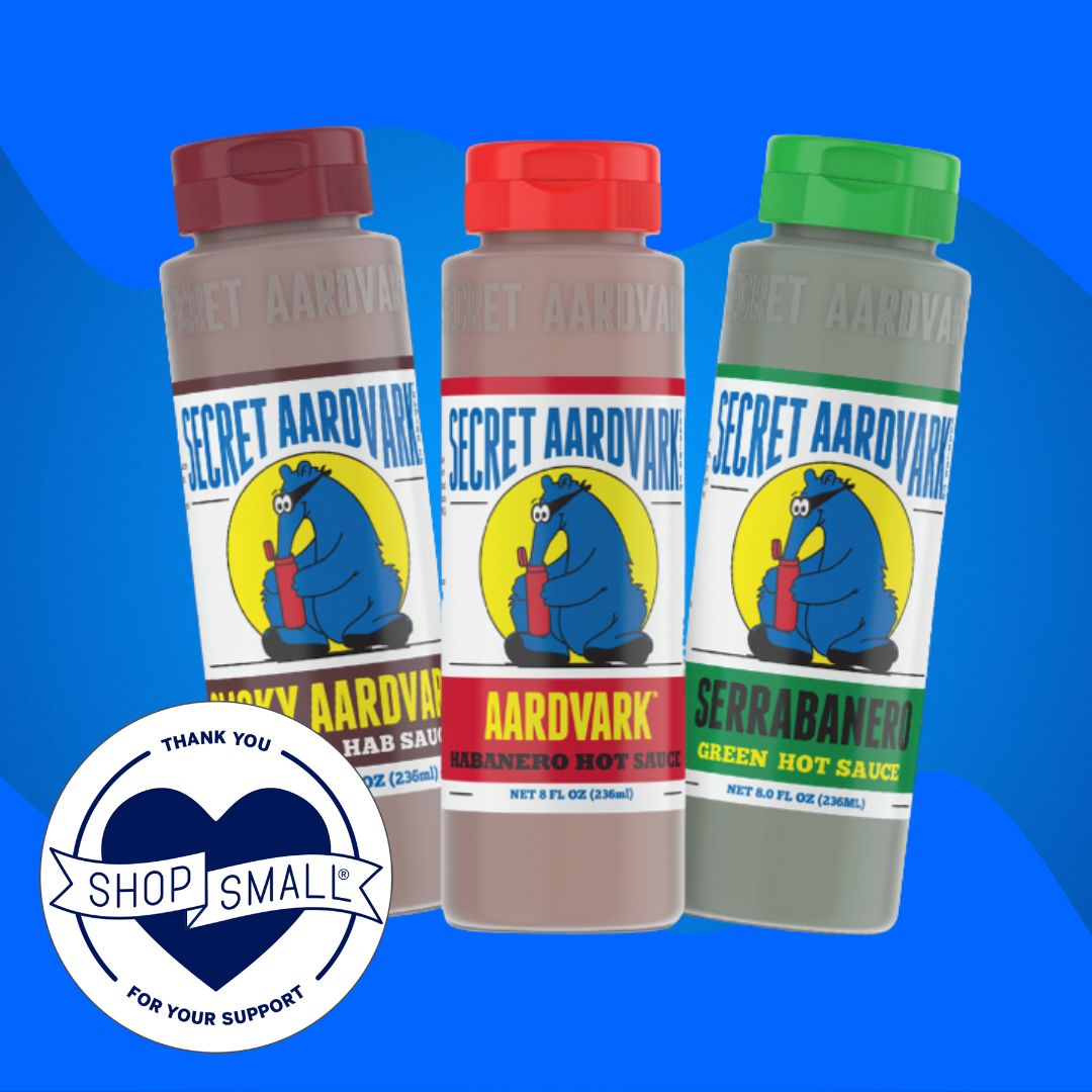 Three Secret Aardvark Sauce bottles, with the Small Business Saturday logo, which says thank you for shopping small.