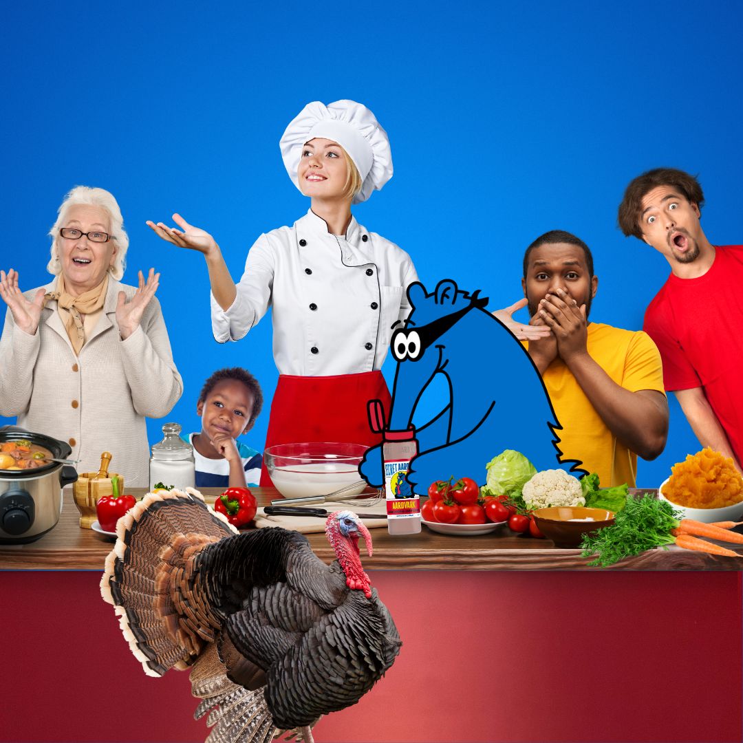 A family around a Thanksgiving table sitting with a blue cartoon aardvark.