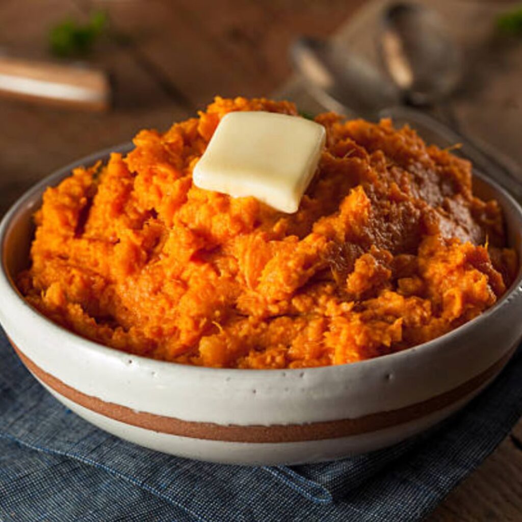 A creamy bowl of mashed sweet potatoes with Aardvark Chipotle-Hab Sauce