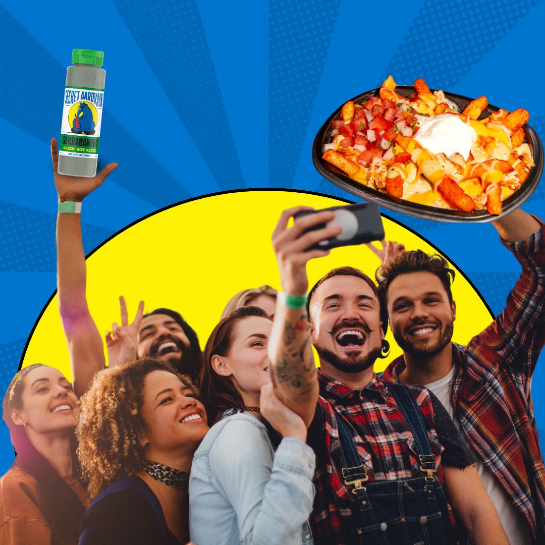 A group of friends taking selfies with a tray of Taco Bell Secret Aardvark Nacho Fries.