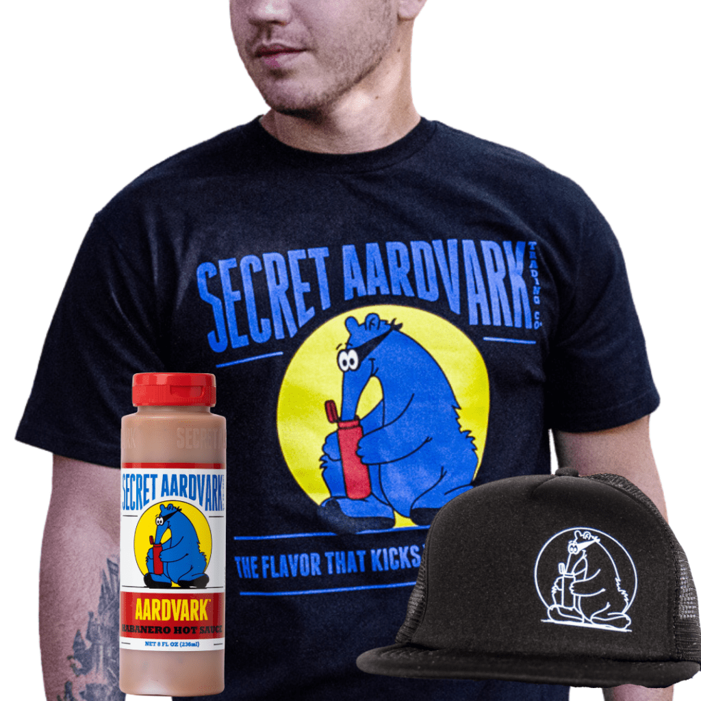 men in Secret Aardvark tshirt, trucker hat and bottle of Aardvark hot sauce.
