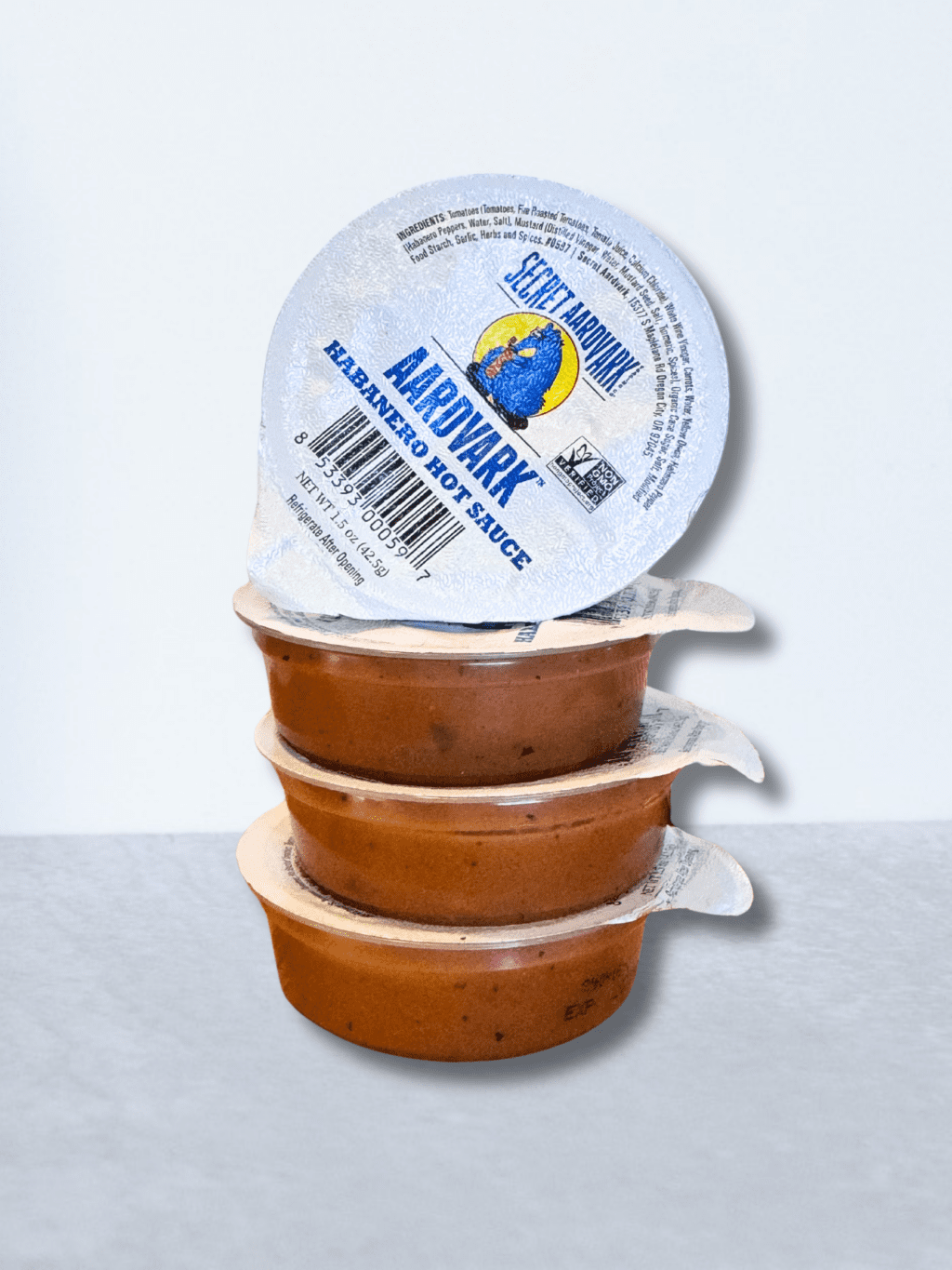 stack of 3 dipping cupr with a fourth on top. Featuring the Aardvark Habanero 1.5 oz cup.
