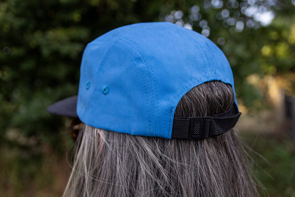 Back/side view of Aardvark blue camper hat.