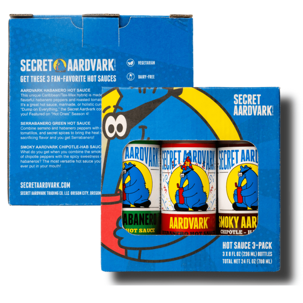 Box of 3-pack gift set. Box is blue with the Aardvark logo and a window cut out showing the three hot sauces: Aardvark Habanero, Serrabanero, and Smoky. This image show front and back version of the box set.